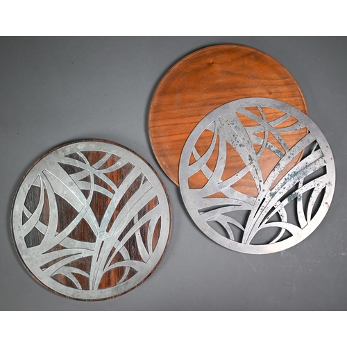 156 - Yvonne Renouf-Smith: a pair of modern design rosewood place-mats inset with foliate-pierced silver t... 