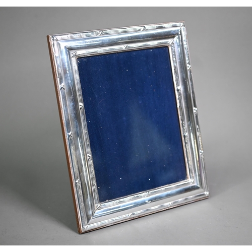 162 - A modern Britannia standard silver photograph frame on wooden back, Ray Hall, Birmingham (no date), ... 