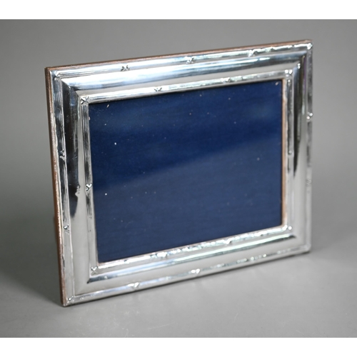 162 - A modern Britannia standard silver photograph frame on wooden back, Ray Hall, Birmingham (no date), ... 