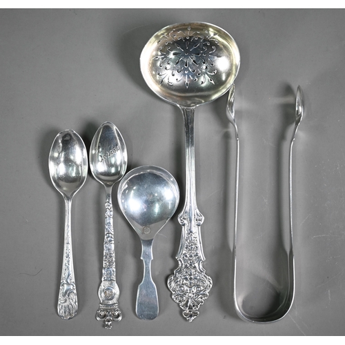 165 - A Victorian silver sifter ladle with ornate handle Brewis & Co, London 1891, to/w a pair of Geor... 