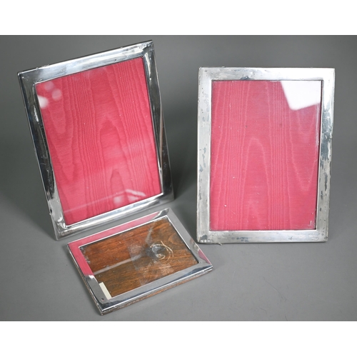 168 - Two silver photograph frames, Birmingham 1918/19, 24 x 19cm, to/w a smaller example, Birmingham 1928... 