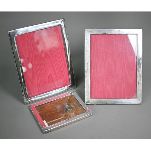 168 - Two silver photograph frames, Birmingham 1918/19, 24 x 19cm, to/w a smaller example, Birmingham 1928... 