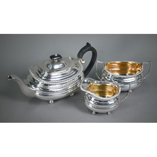 175 - A heavy quality silver three-piece tea service in the Regency manner, of compressed oblong form with... 