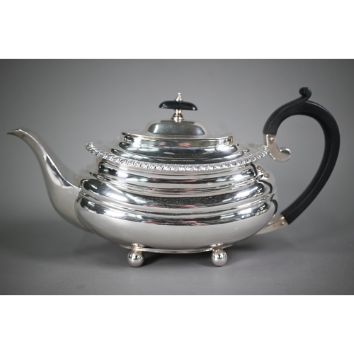 175 - A heavy quality silver three-piece tea service in the Regency manner, of compressed oblong form with... 