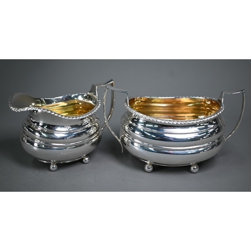 175 - A heavy quality silver three-piece tea service in the Regency manner, of compressed oblong form with... 