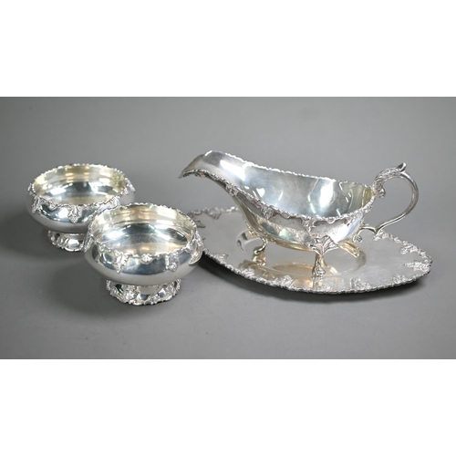19 - A white metal sauce boat on stand, to/w a matching pair of small bowls, stamped 'Silver' (4 pieces -... 