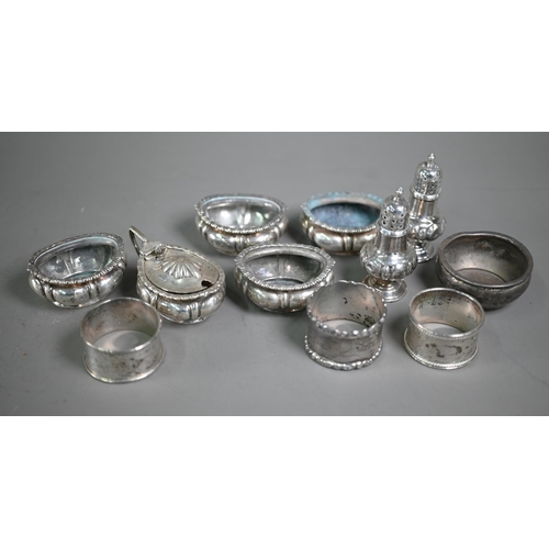 215 - A late Victorian silver seven-piece condiment set (a/f), Sheffield 1896, to/w three napkin rings and... 