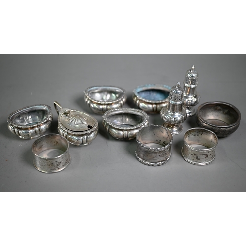 215 - A late Victorian silver seven-piece condiment set (a/f), Sheffield 1896, to/w three napkin rings and... 