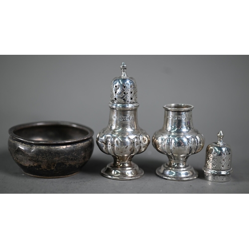 215 - A late Victorian silver seven-piece condiment set (a/f), Sheffield 1896, to/w three napkin rings and... 