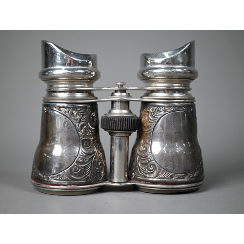 217 - An Edwardian pair of binoculars with embossed silver cladding, London 1904, to/w a Victorian silver ... 