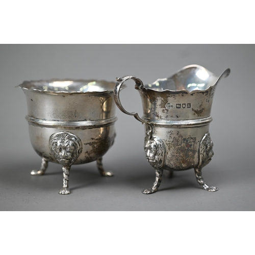 224 - An Edwardian silver cream & sugar pair, with cut rims, scroll handles and lion-mask monopodia, L... 