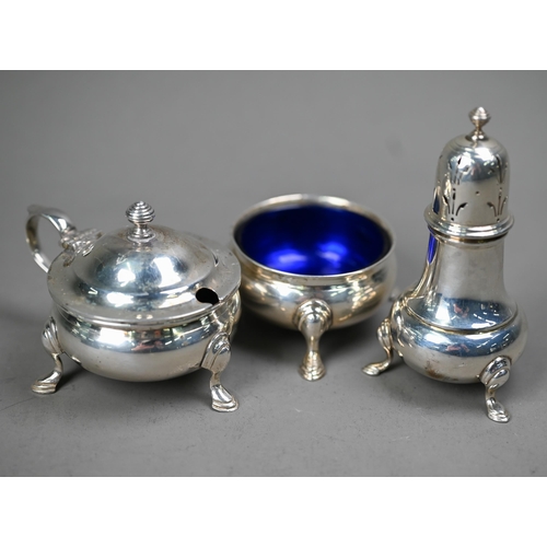 226 - A silver three-piece condiment set in the Georgian taste, on hoof feet, William Suckling Ltd, Birmin... 