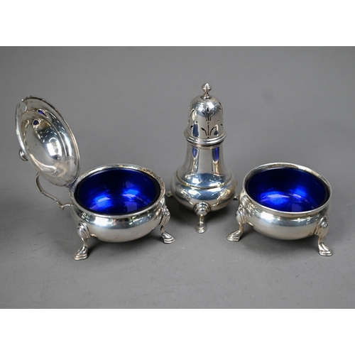 226 - A silver three-piece condiment set in the Georgian taste, on hoof feet, William Suckling Ltd, Birmin... 