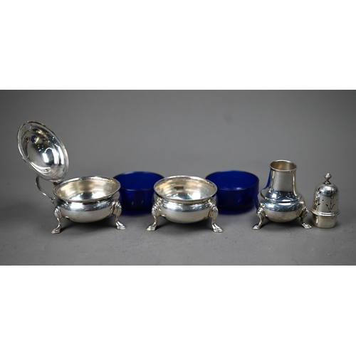 226 - A silver three-piece condiment set in the Georgian taste, on hoof feet, William Suckling Ltd, Birmin... 