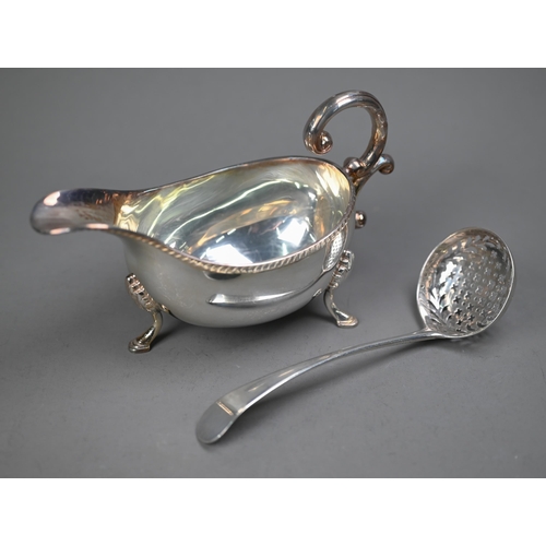 229 - A George III silver old English pattern sifter ladle, Richard Crossley, London 1788, to/w a sauce bo... 