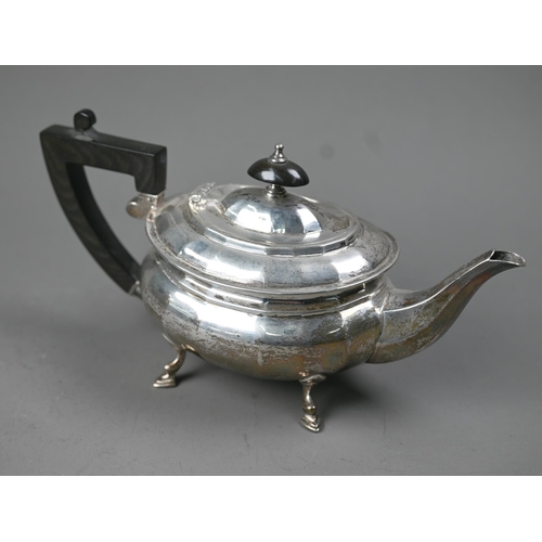 230 - A heavy quality silver bachelor teapot of ovoid form, with composite handle and finial, on hoof feet... 