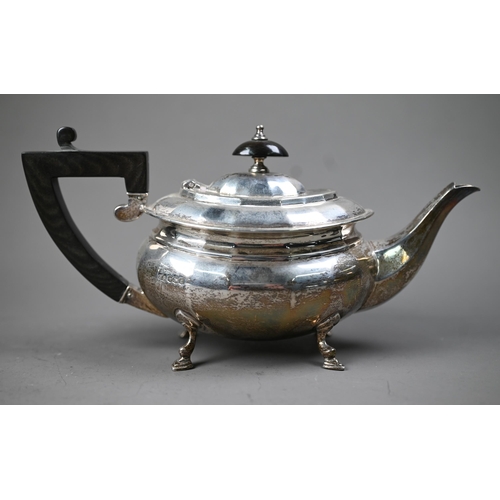 230 - A heavy quality silver bachelor teapot of ovoid form, with composite handle and finial, on hoof feet... 