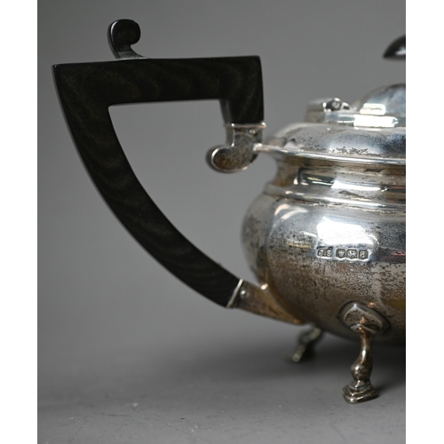 230 - A heavy quality silver bachelor teapot of ovoid form, with composite handle and finial, on hoof feet... 