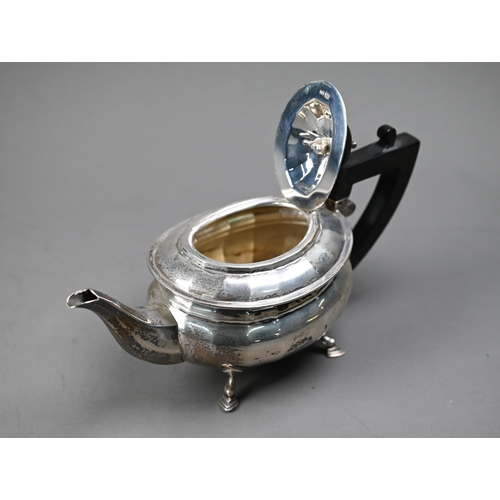 230 - A heavy quality silver bachelor teapot of ovoid form, with composite handle and finial, on hoof feet... 