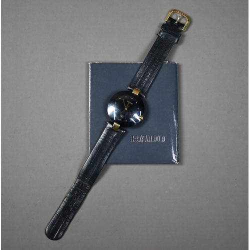 249 - WITHDRAWN A Rado Dia Star wristwatch, black dial and gilt, with black leather strap, c/w documents, ... 