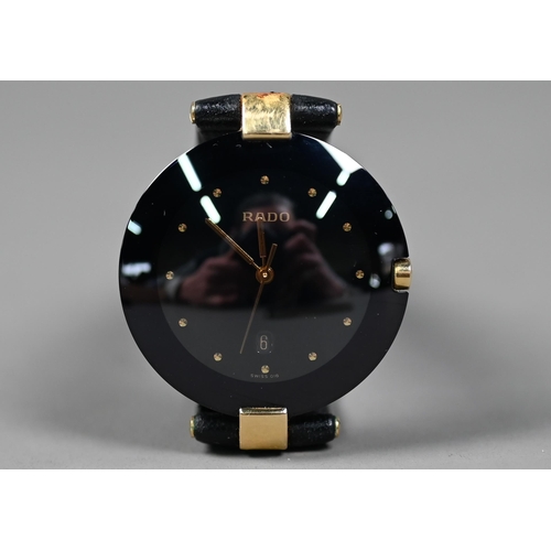 249 - WITHDRAWN A Rado Dia Star wristwatch, black dial and gilt, with black leather strap, c/w documents, ... 