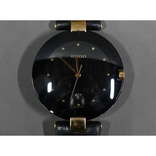 249 - WITHDRAWN A Rado Dia Star wristwatch, black dial and gilt, with black leather strap, c/w documents, ... 