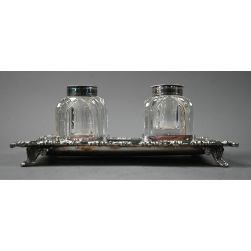 30 - A Victorian EPBM inkstand with twin glass bottles, with cast rim and four scroll feet, James Dixon &... 