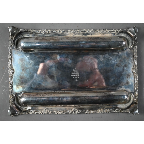 30 - A Victorian EPBM inkstand with twin glass bottles, with cast rim and four scroll feet, James Dixon &... 