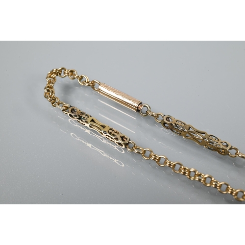 315 - A 9ct yellow gold fancy link chain with alternate square-sided links with pierced decoration and cha... 