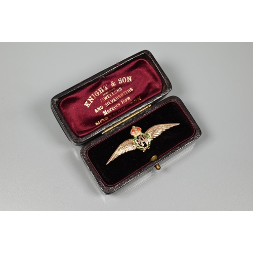 319 - A yellow metal RAF wings brooch, with green and red enamelled details, stamped 9ct, 4.5 cm long, app... 