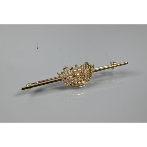 321 - A yellow metal seed pearl set coronet bar brooch, stamped 14ct, 5.5 cm long, approx 3.5 g all in