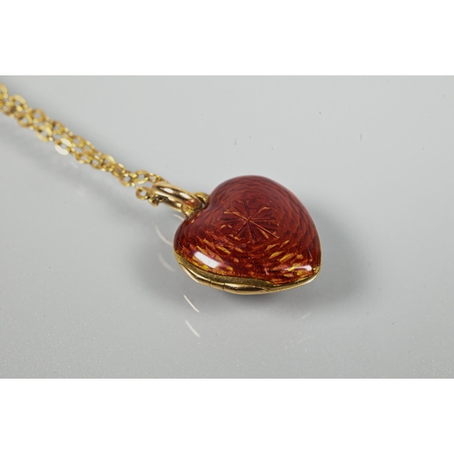 330 - A Victorian red enamel locket pendant, the heart-shaped locket with guilloche red enamel, set with a... 