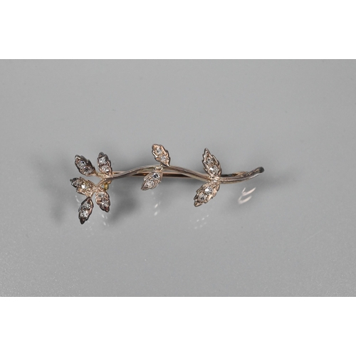 336 - WITHDRAWN An Edwardian diamond brooch in the form of a leaf tendril, the leaves set with old cut dia... 