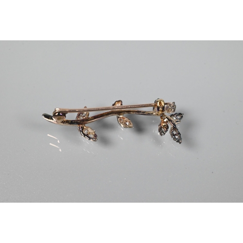 336 - WITHDRAWN An Edwardian diamond brooch in the form of a leaf tendril, the leaves set with old cut dia... 