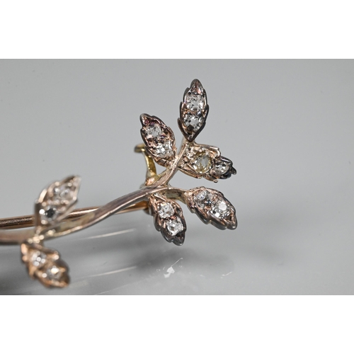 336 - WITHDRAWN An Edwardian diamond brooch in the form of a leaf tendril, the leaves set with old cut dia... 