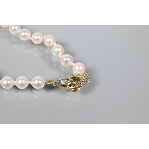 337 - WITHDRAWN A cultured pearl bracelet, the uniform pearls double knotted throughout onto yellow metal ... 