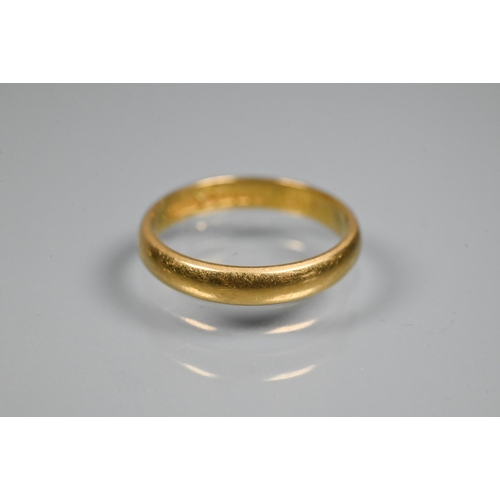 338 - A 22ct yellow gold wedding band, size J, approx 2.9g