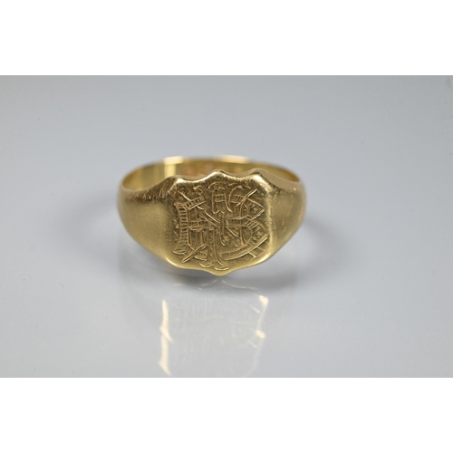 340 - An 18ct yellow gold signet ring with shaped face engraved with monogram, size S, 5.8g; a 22ct yellow... 