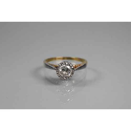 343 - WITHDRAWN A single stone diamond ring, the diamond in rubover setting, platinum and 18ct yellow gold... 