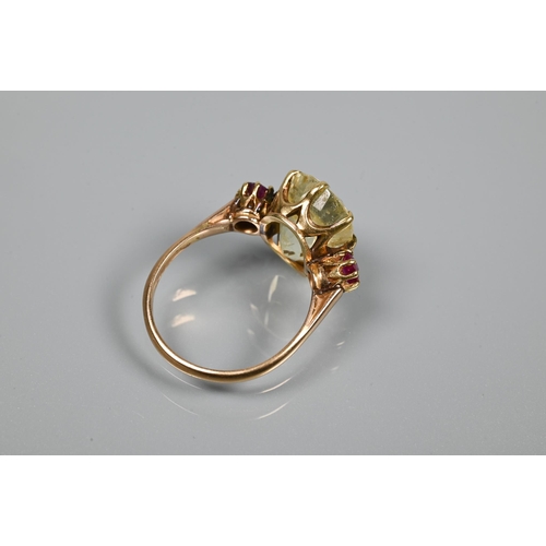 346 - An 18ct yellow gold ring set with central pale yellow stone with ruby to each side, size Q