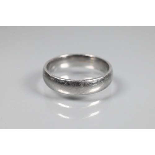 349 - A wide platinum wedding band, size V, approx 11g