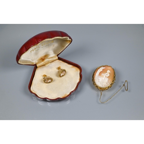 352 - An oval shell cameo brooch featuring Rachel at the well, in belcher-chain style mount stamped 9ct, f... 