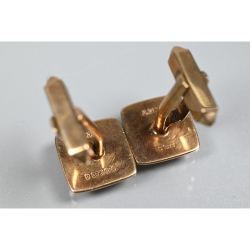 353 - A pair of 9ct yellow gold cufflinks of square design with engine-turned decoration, with swivel back... 