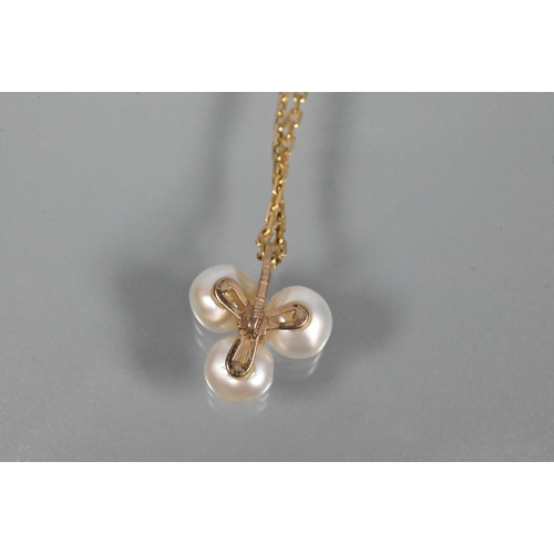 359 - A cultured pearl pendant, the triple baroque pearl cluster surrounding a small cubic zirconia, 9ct y... 