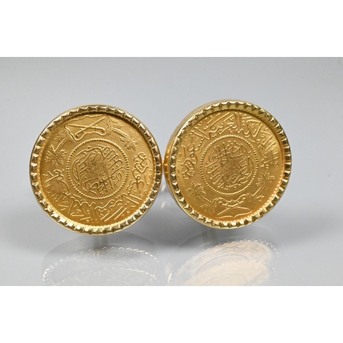 366 - A pair of Persian coin-set cufflinks in yellow metal mount with swivel backs, stamped 750, 2.3 cm di... 