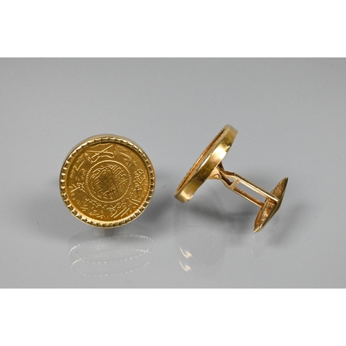 366 - A pair of Persian coin-set cufflinks in yellow metal mount with swivel backs, stamped 750, 2.3 cm di... 