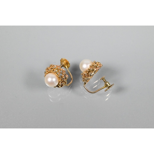 368 - A pair of cultured pearl set earrings in open beadwork mounts, screw fittings, stamped 9ct