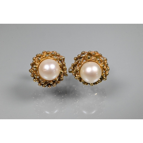 368 - A pair of cultured pearl set earrings in open beadwork mounts, screw fittings, stamped 9ct