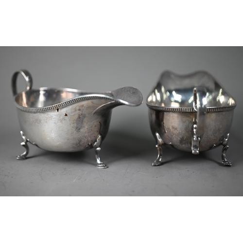 46 - Pair of silver sauce boats with scroll handles and hoof feet, Martin, Hall & Co, Sheffield 1925,... 