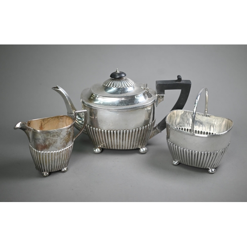 74 - Victorian silver three-piece bachelor tea service of half-fluted oblong form, on later plated bun fe... 